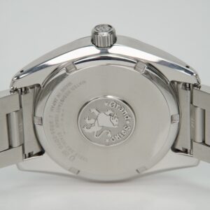 Back of silver wristwatch with engraved logo.