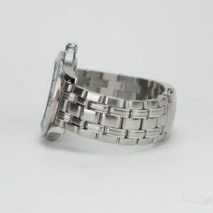 Silver metal wristwatch with linked band.