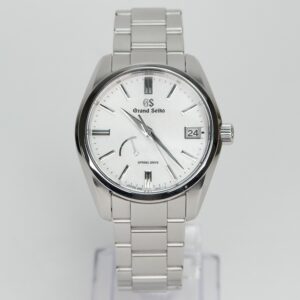 Silver Grand Seiko watch with white dial.