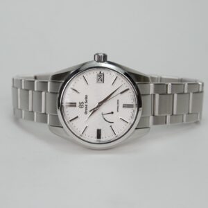 Silver wristwatch with white dial and bracelet.