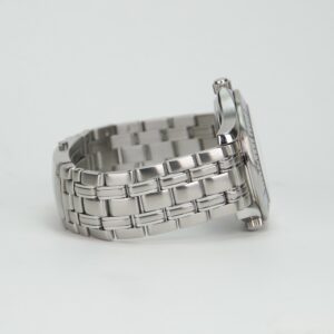 Silver wristwatch with metal bracelet side view.