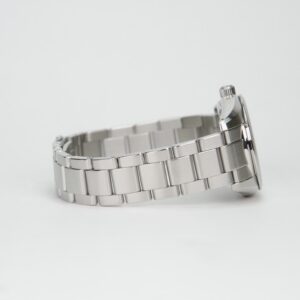 Steel wristwatch with metal link band.
