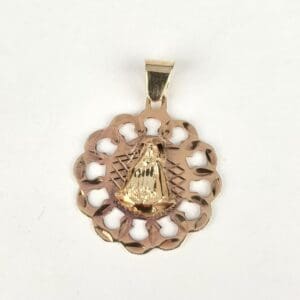 Gold pendant with intricate design.