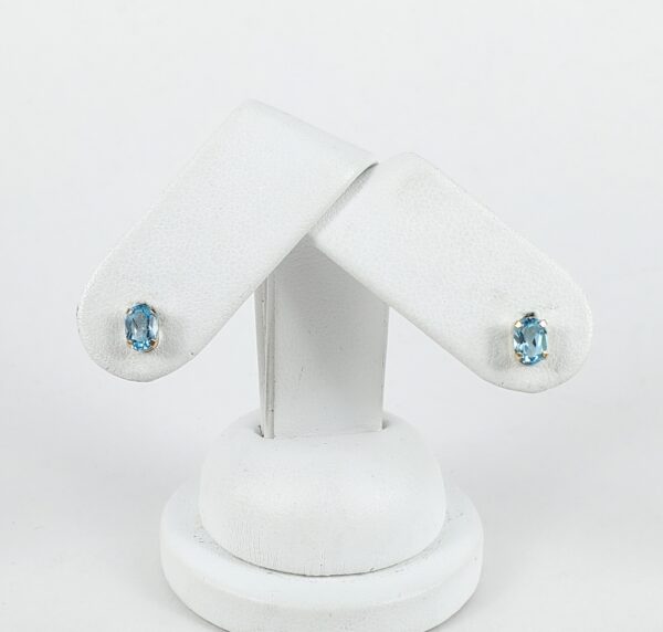 10k Yellow Gold .90ctw Oval Cut Blue Topaz Stud Earrings - Image 4